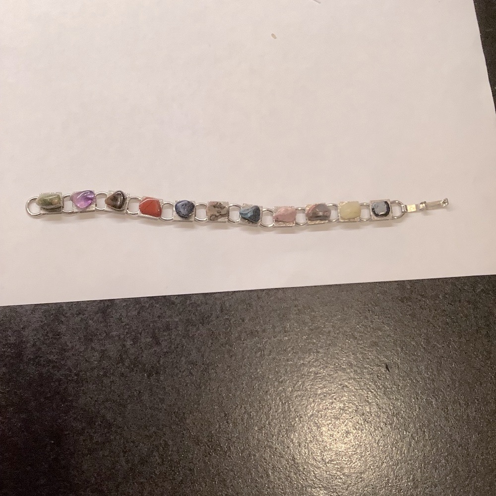 Bracelet of Sterling Silver with multi stones like new.